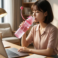 Pink sports water bottle showing ergonomic design