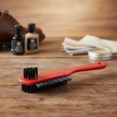 Cleaning brush showing dual-sided bristles