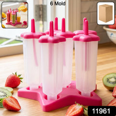 Close-up of plastic popsicle molds filled with juice