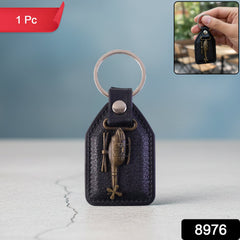 Leather metal sword emblem keychain close-up detail