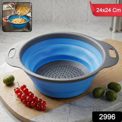 Folded silicone colander showing space-saving design in kitchen.