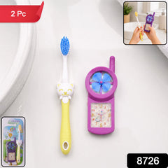 Close-up of a blue kids cartoon toothbrush with a fan toy
