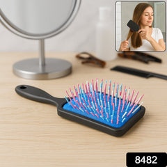Massage hair comb side view showing ergonomic handle
