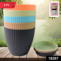 Close-up of round flower pots with matte finish and stripes