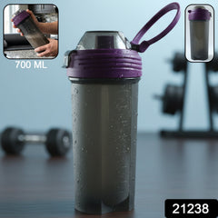 Clear plastic protein shaker bottle with flip lid