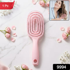 Pink curved vented detangling hair brush in packaging