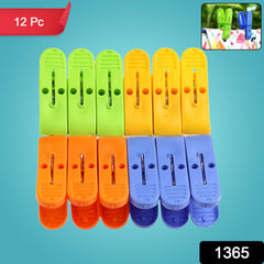 Close-up of colorful plastic cloth drying clips with stainless steel grips.