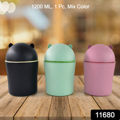 Cute mini dustbin on a wooden desk