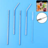 Set of 4 stainless steel straws with cleaning brush arranged on white background