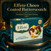 Effete Choco Coated Butterscotch box on a dark green pedestal with gold accents and draped fabric.