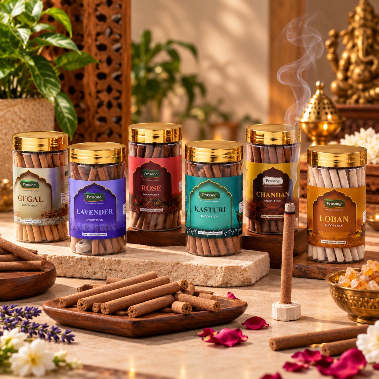 Six clear jars of dhoop sticks with gold lids, arranged on a stone surface with a lit stick and rose petals.