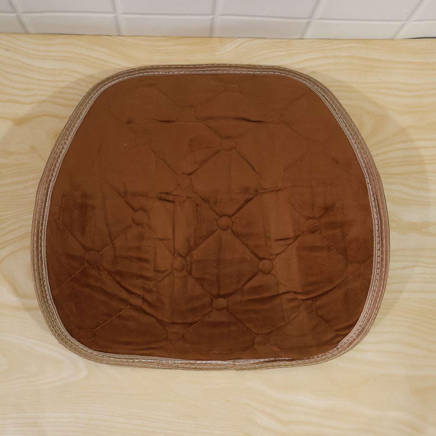Brown quilted velvet lumbar support cushion from different angle