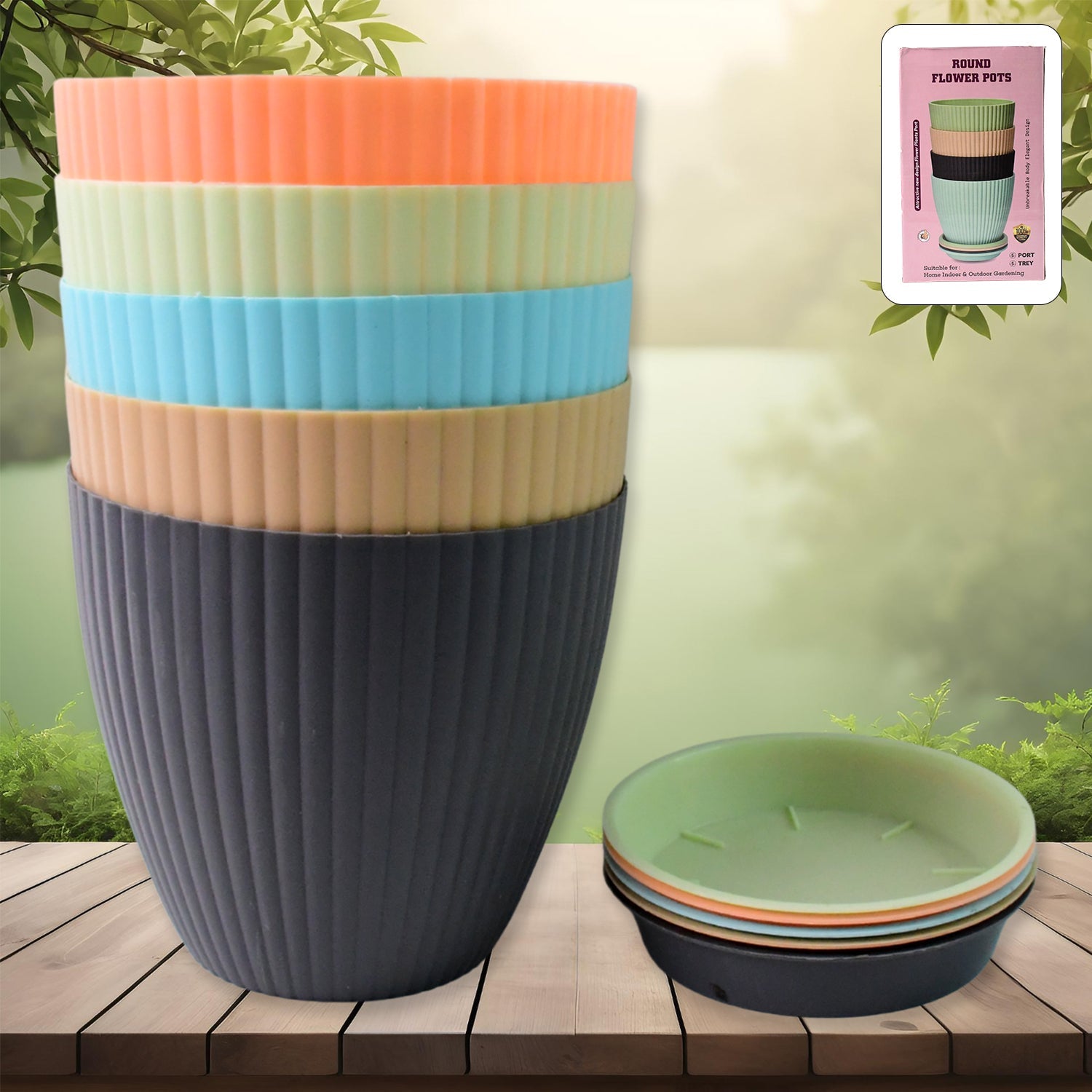 Set of 5 round plastic flower pots with trays on wooden surface