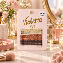 A pack of 24 glittery bobby pins in gold, copper, and dark brown, displayed on a pink card.