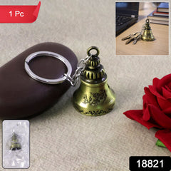 Handcrafted ringing temple bell keychain on black background