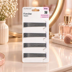 A white package of twenty-four silver hairpins on a vanity, with a mirror, vase of flowers, and a makeup brush.