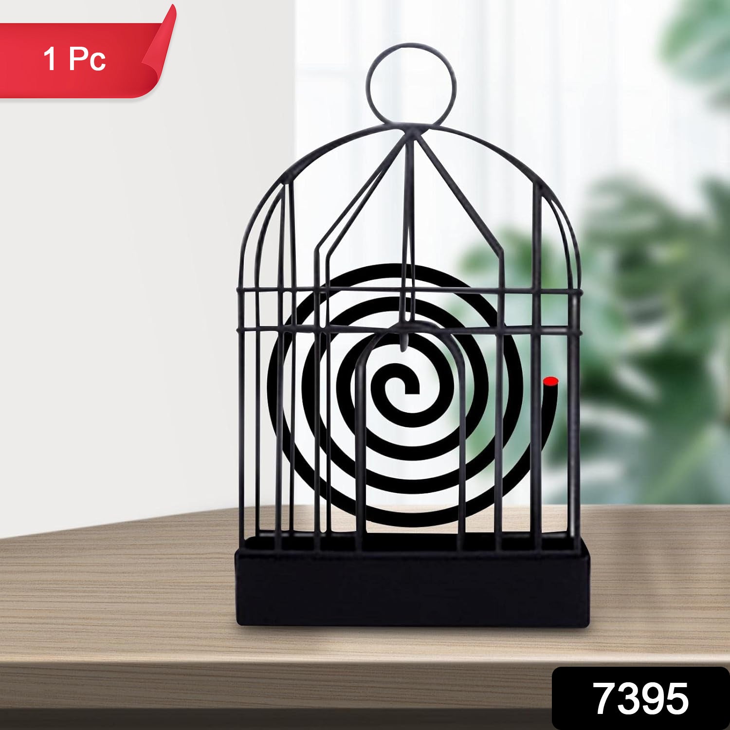 Iron mosquito coil stand with birdcage design on wooden table