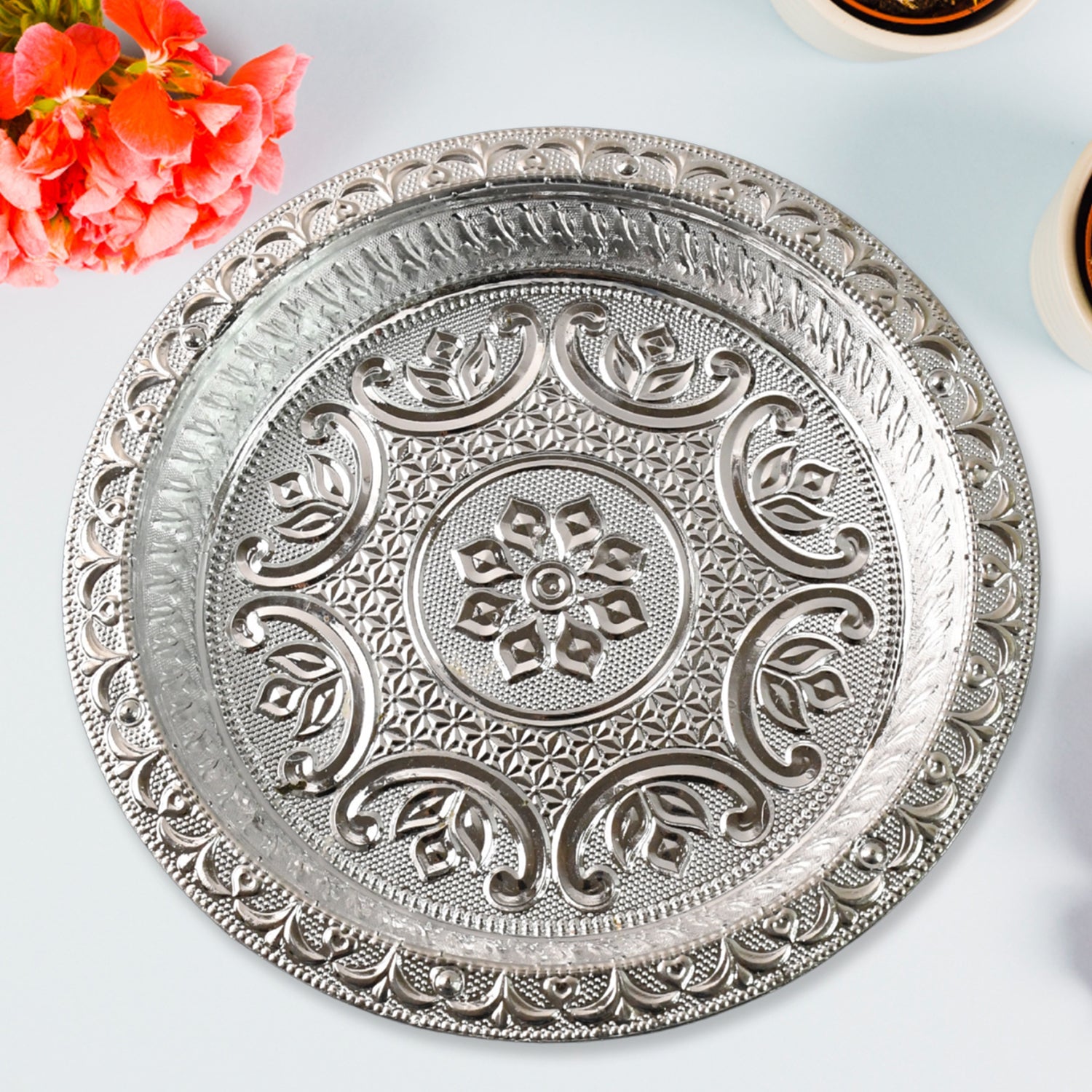 Detailed view of silver finish plastic pooja thali