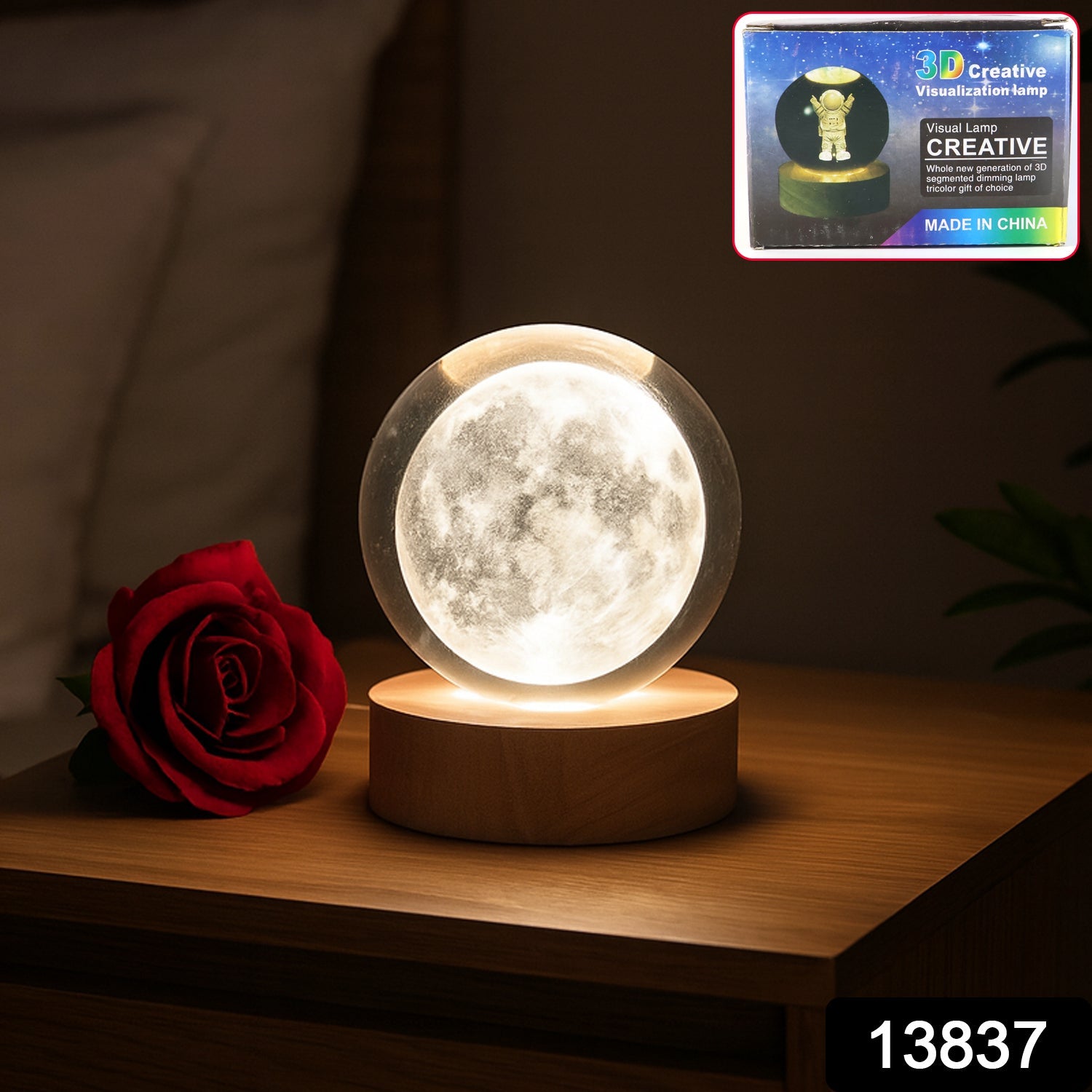 Close-up of illuminated 3D Crystal Ball Lamp with base