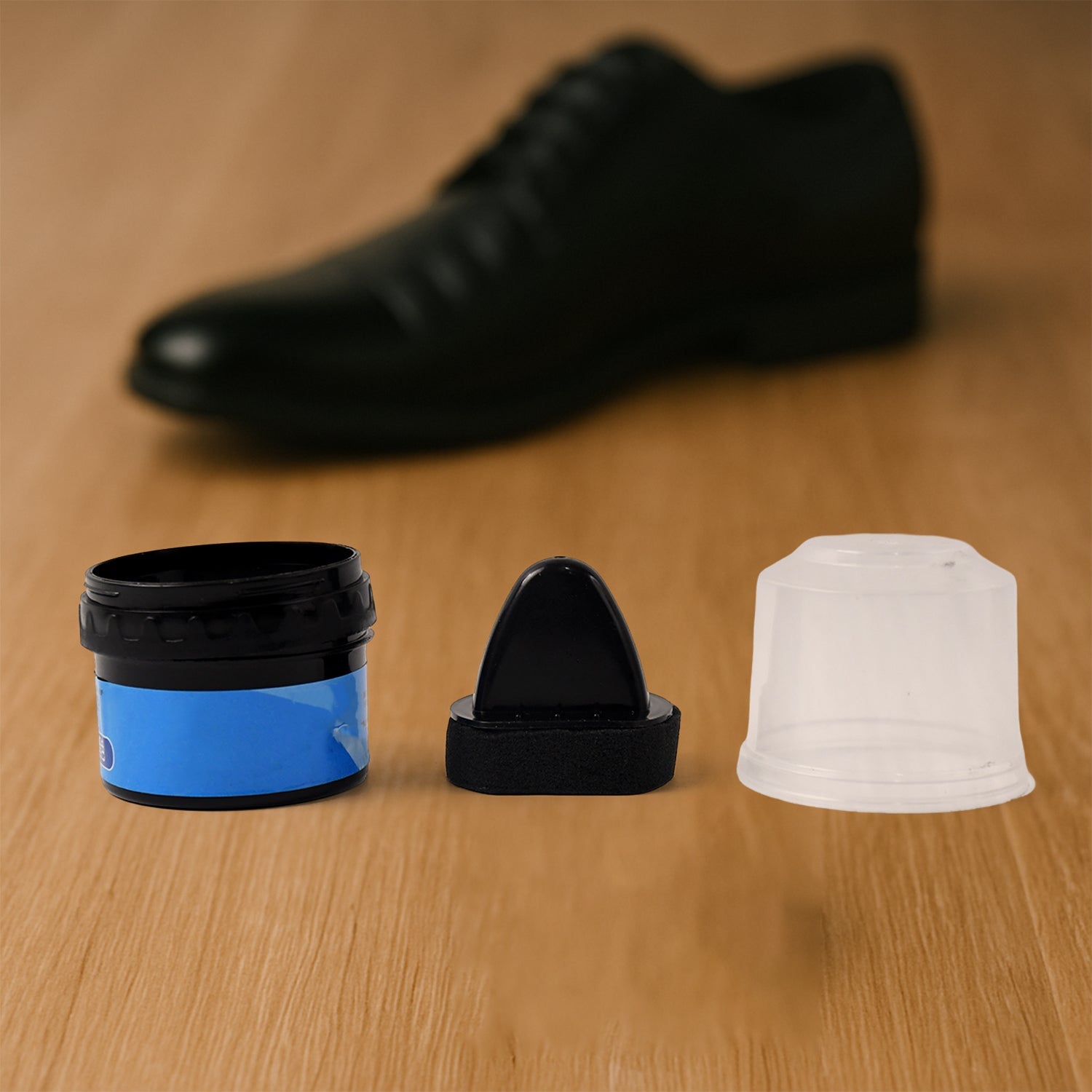 Instant shoe shine sponge beside leather shoes