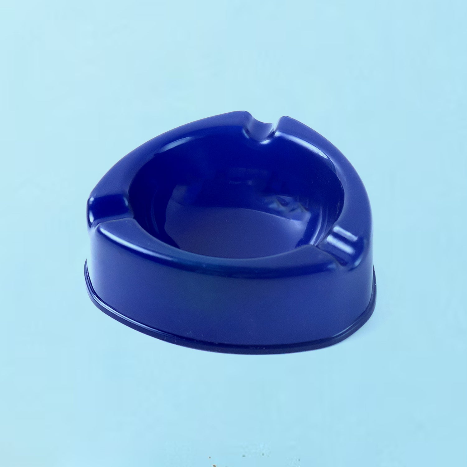 Oblivion Dark Blue Plastic Ashtray showing side view