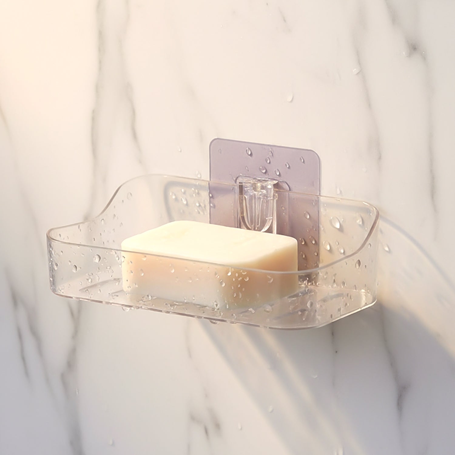 Two clear plastic soap holders side by side