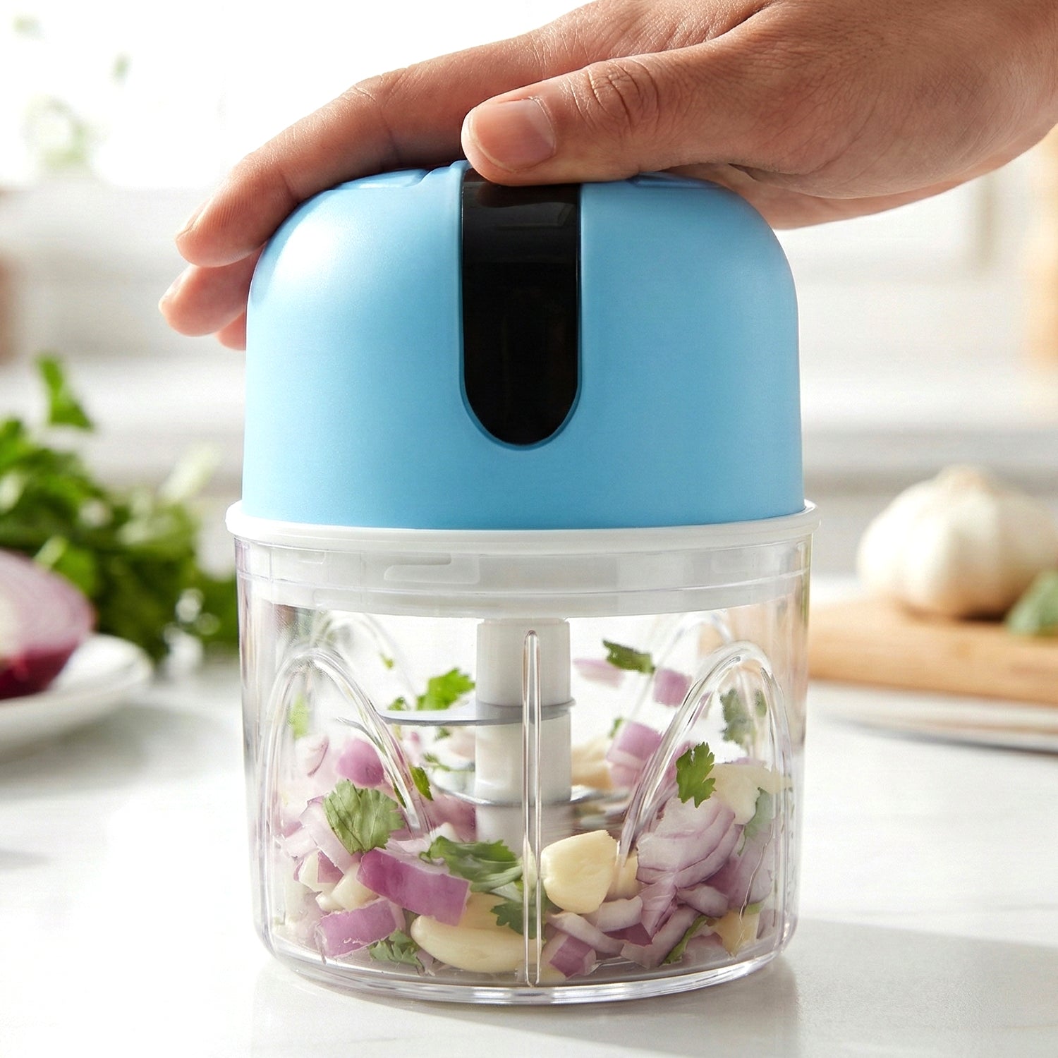Electric garlic chopper in kitchen setting
