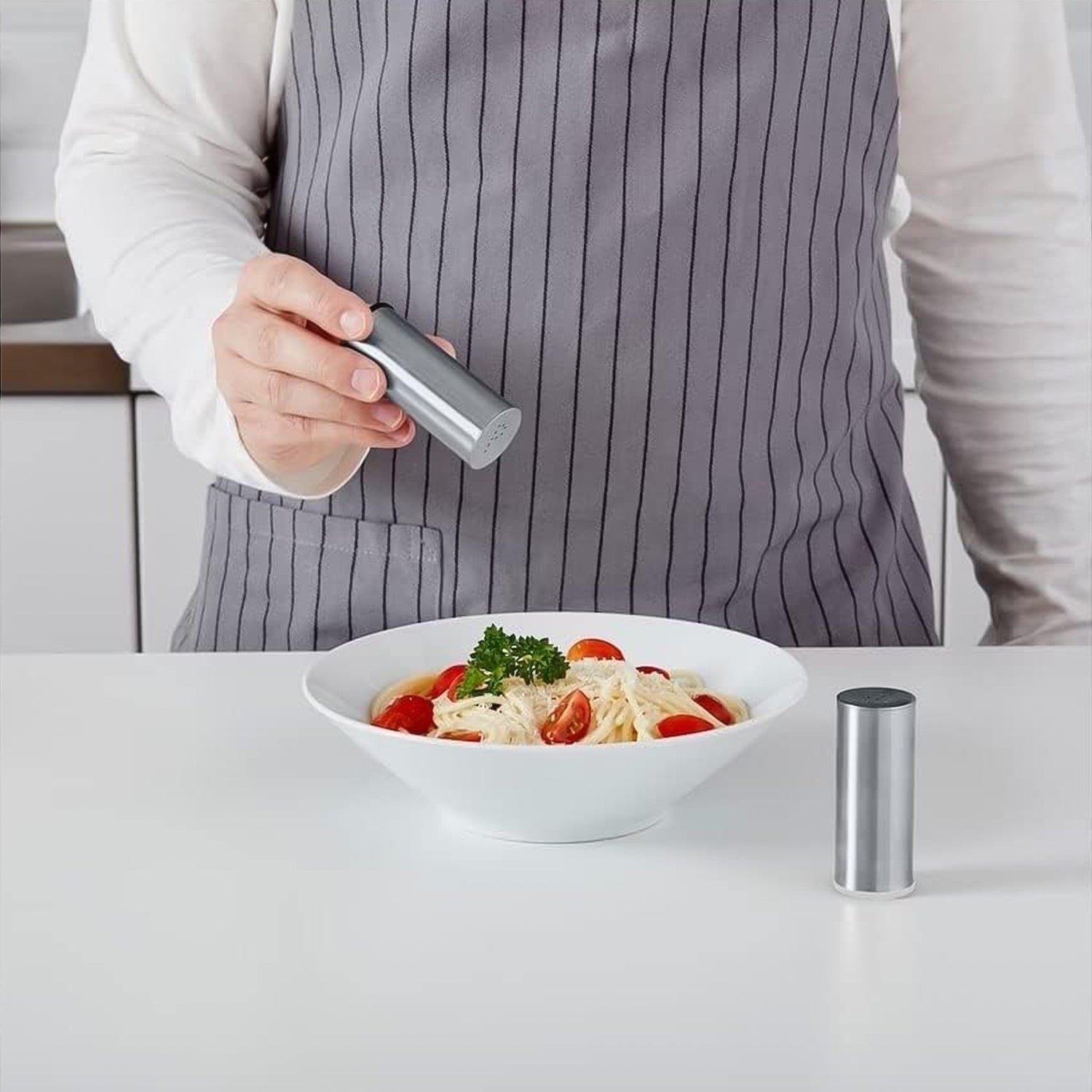 Close-up of stainless steel salt and pepper shaker set