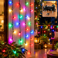 Vibrant multicolor LED string lights illuminate a wall and balcony railing, creating a festive atmosphere with plants. A