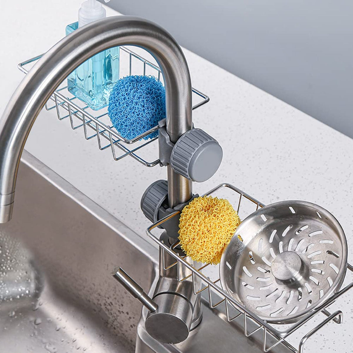 Stainless steel soap and sponge holder caddy on sink