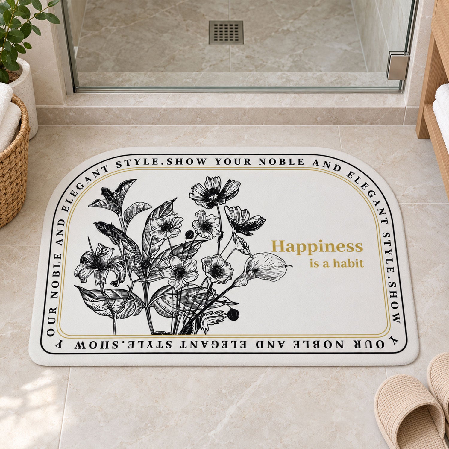 A half-round white mat with a black floral design and a golden quote, next to slippers in a contemporary bathroom.