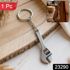 A silver metal mini adjustable wrench keychain with a key ring is displayed on a wooden surface; a "1 Pc" label is visible.