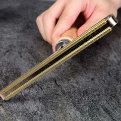 Lint remover showing round brush side