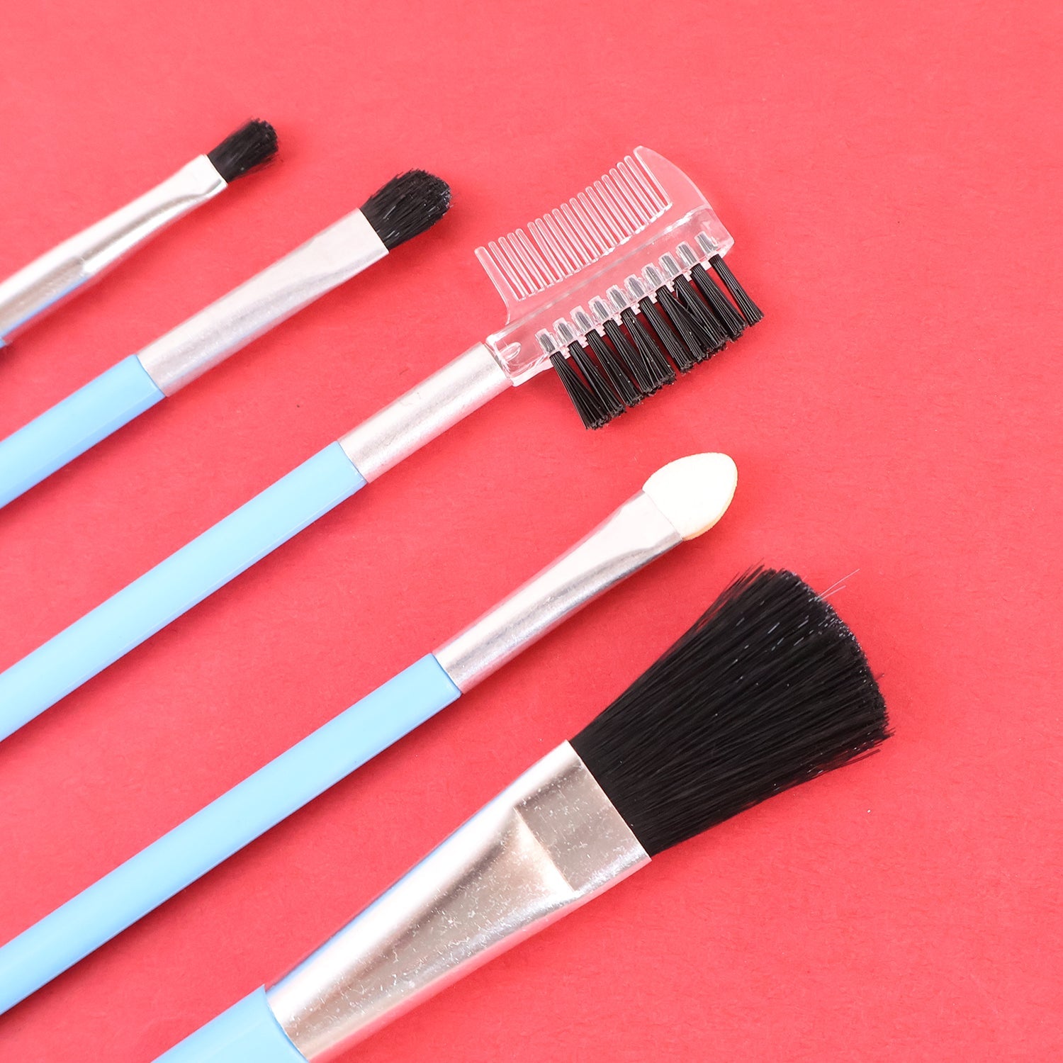 Close-up of angled liner and blush brushes from makeup set