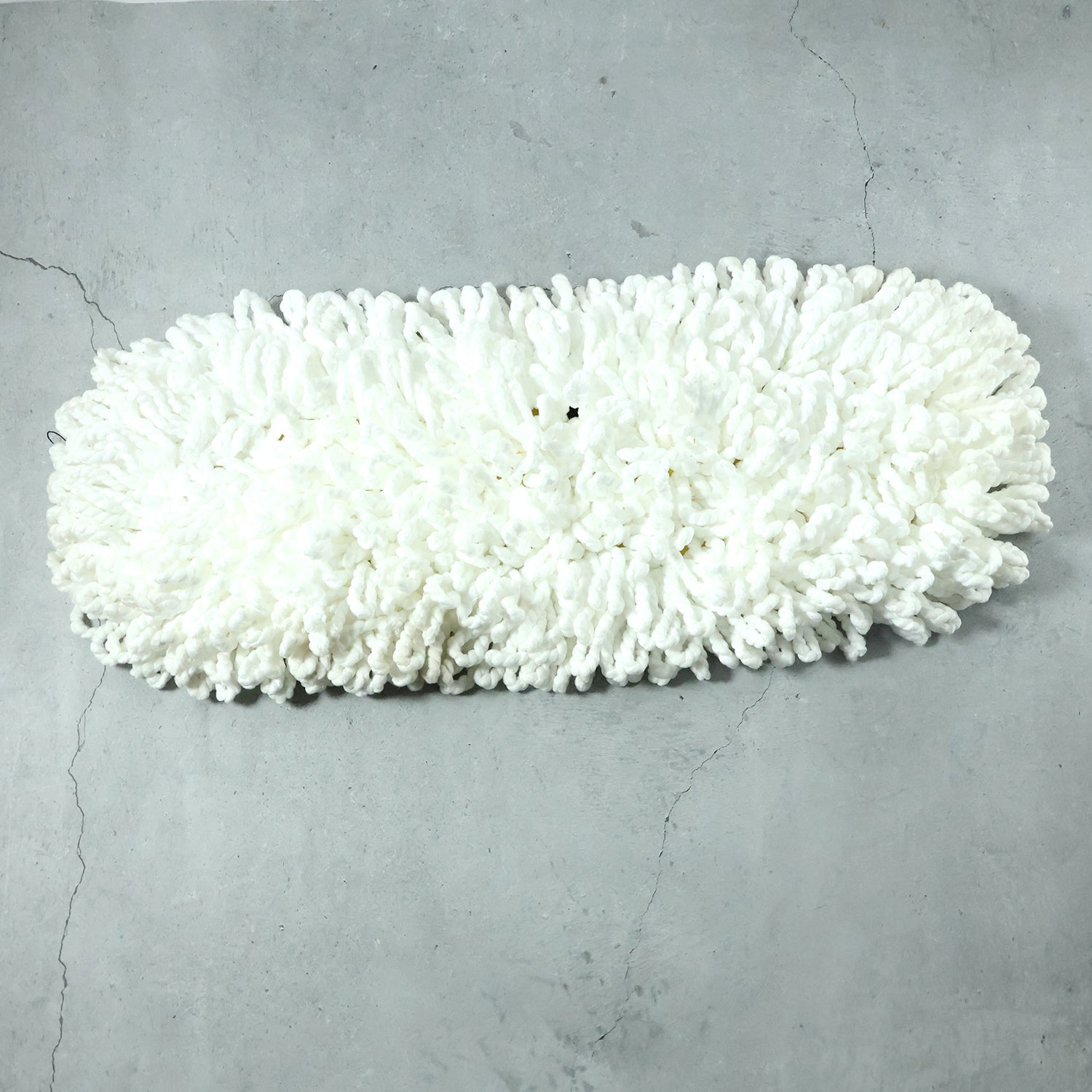 Washed dust mop head drying