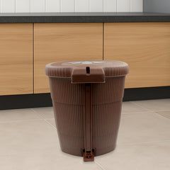 Mini plastic pedal dustbin, side view, showing pedal