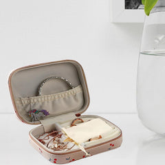 Case opened to show ring and earring slots