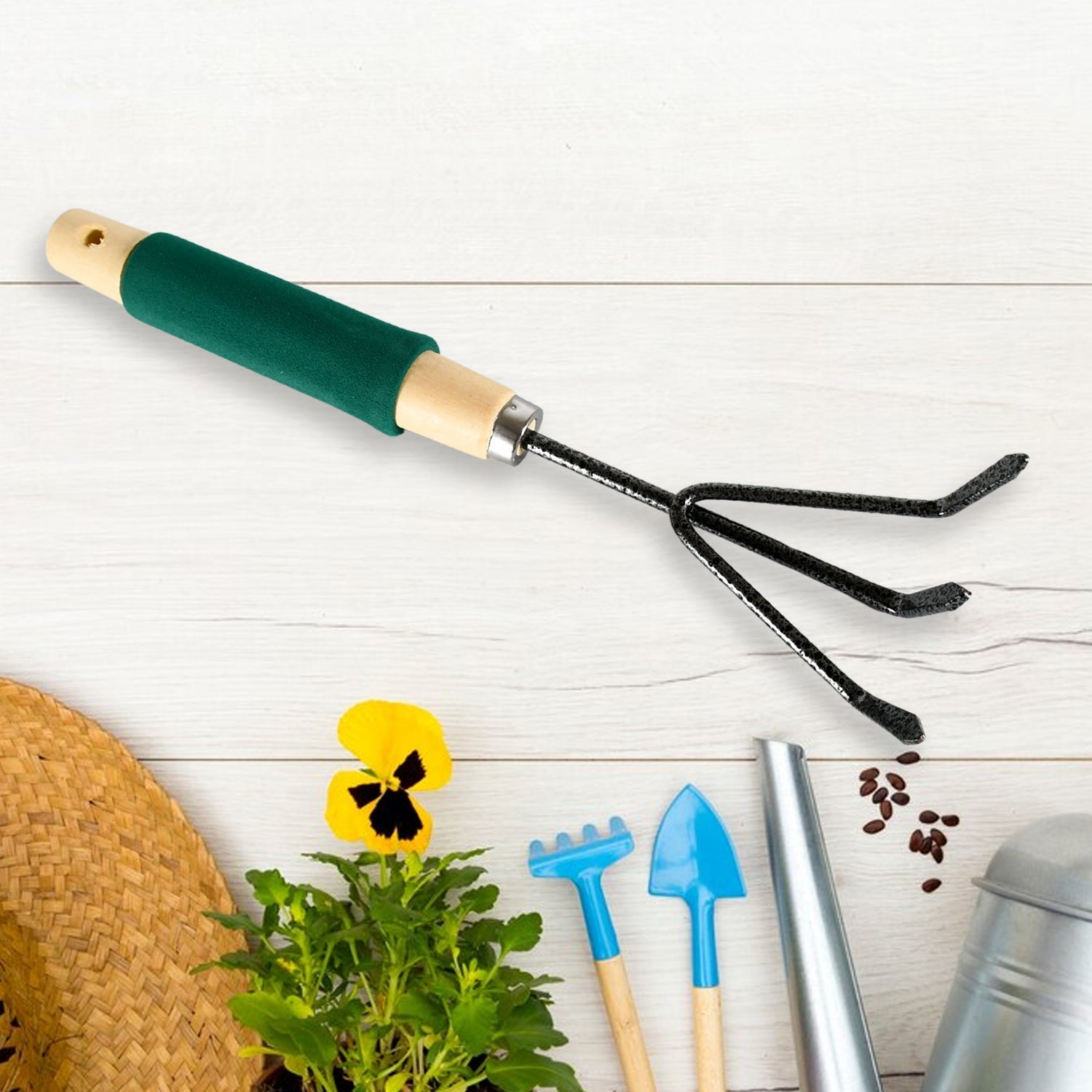 Garden weeder tool with a sharp blade and wooden handle