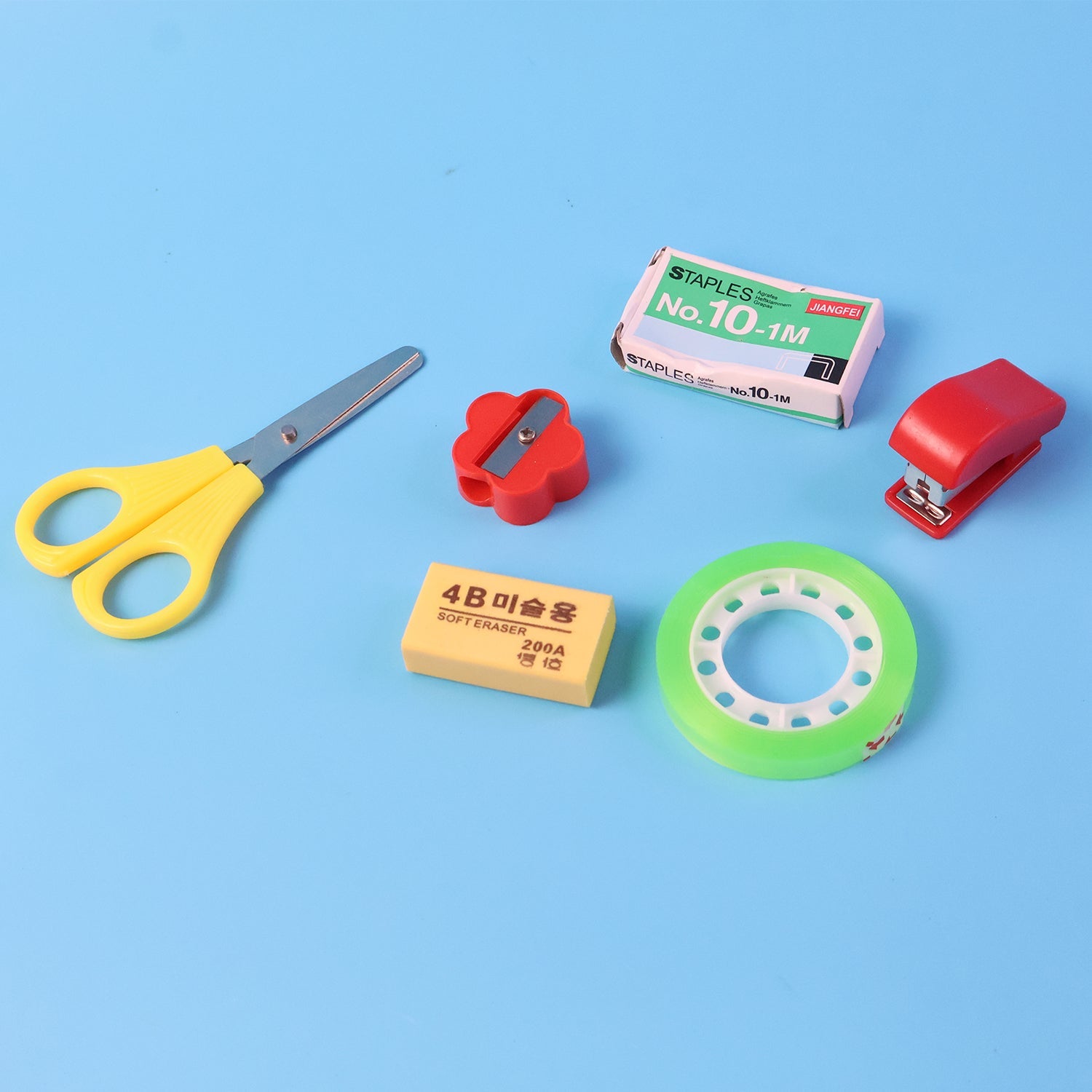 Compact stationery utility kit with tape dispenser and sharpener