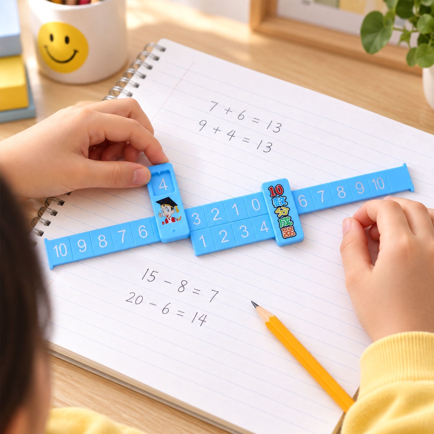 A child's hands hold a blue math ruler with a sliding marker over a spiral notebook displaying arithmetic equations.