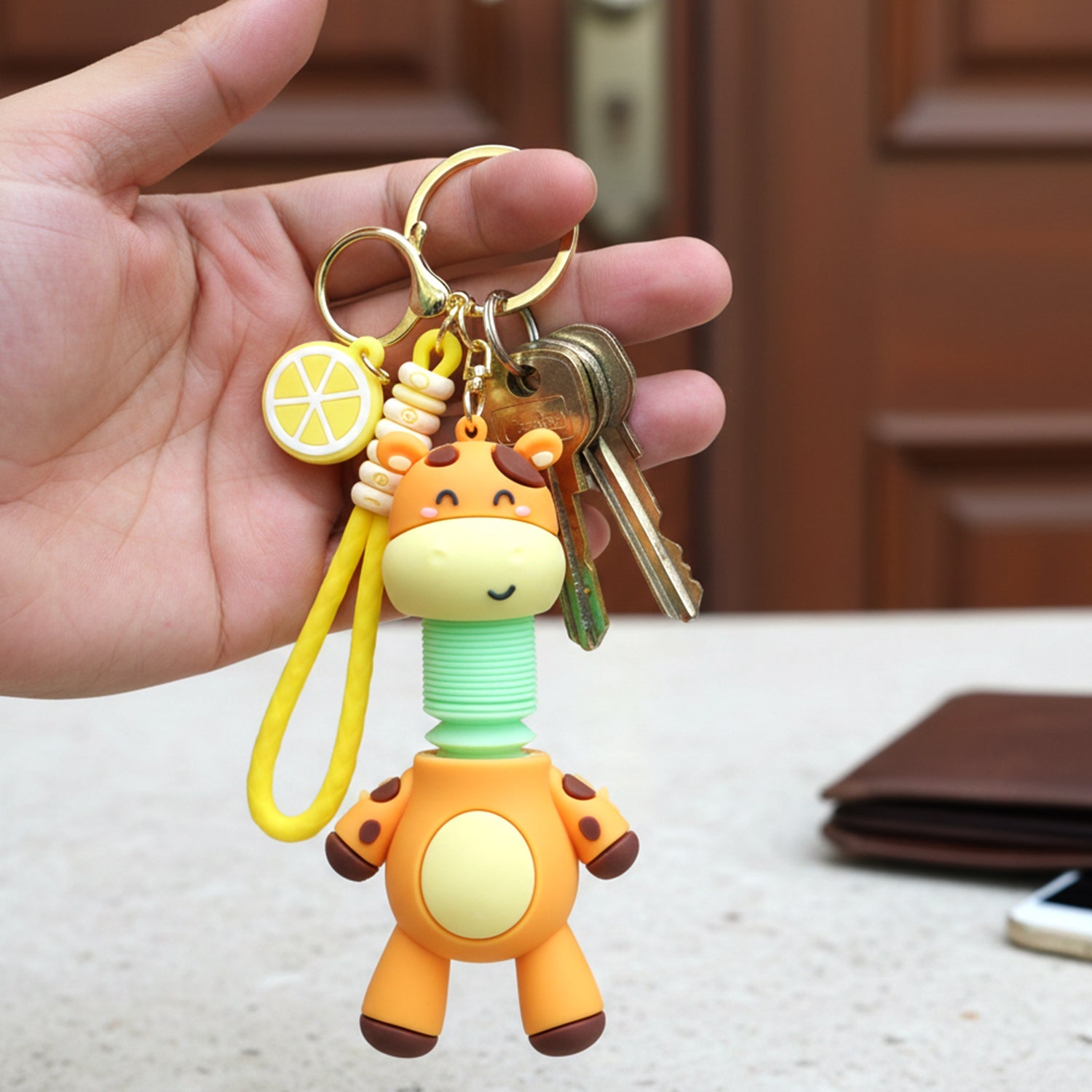 Cartoon giraffe keychain showing spring neck feature
