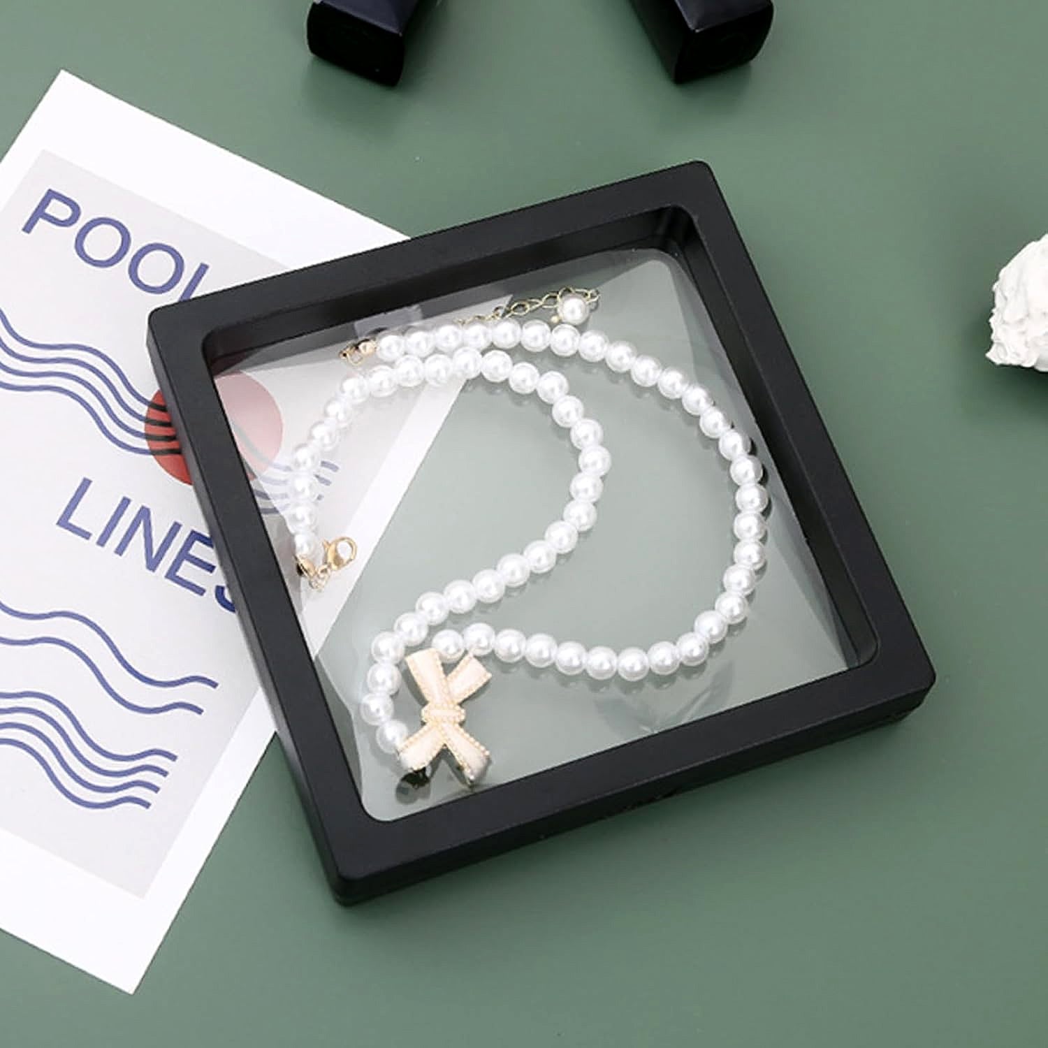 Magnetic lock mechanism on transparent jewellery display box