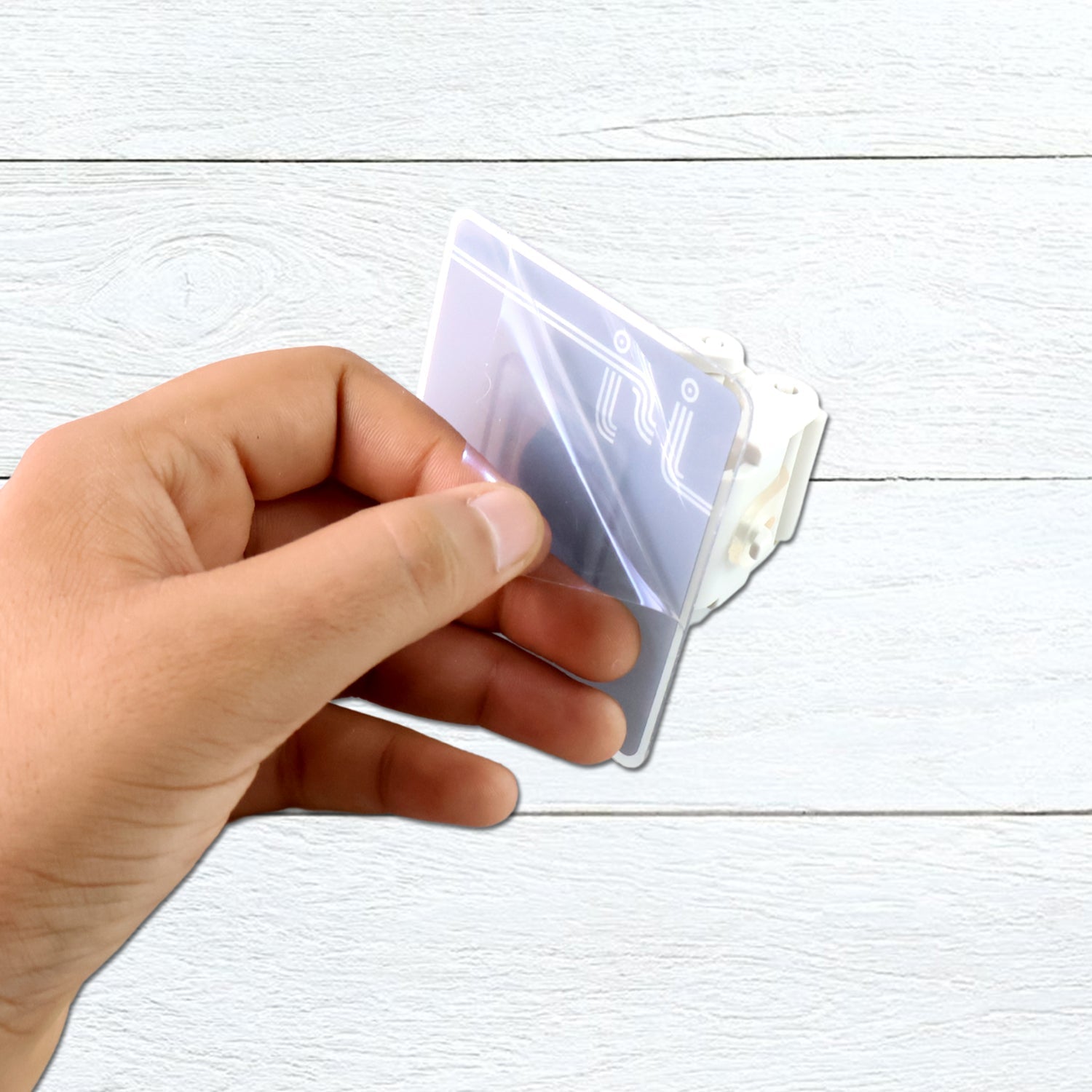 Wall organizer holding a broom, mop, and other cleaning accessories