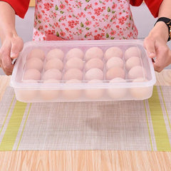 Clear plastic egg container holding 24 eggs, viewed from above