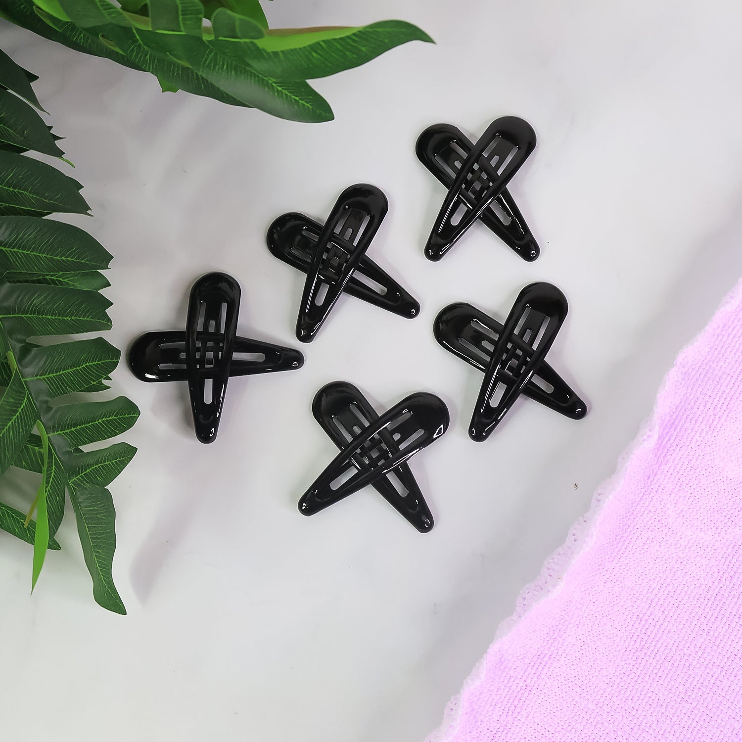 Matte metal hair clips arranged in pastel and bold shades