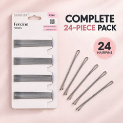A white package of twenty-four silver hairpins next to five loose hairpins on a light pink surface.