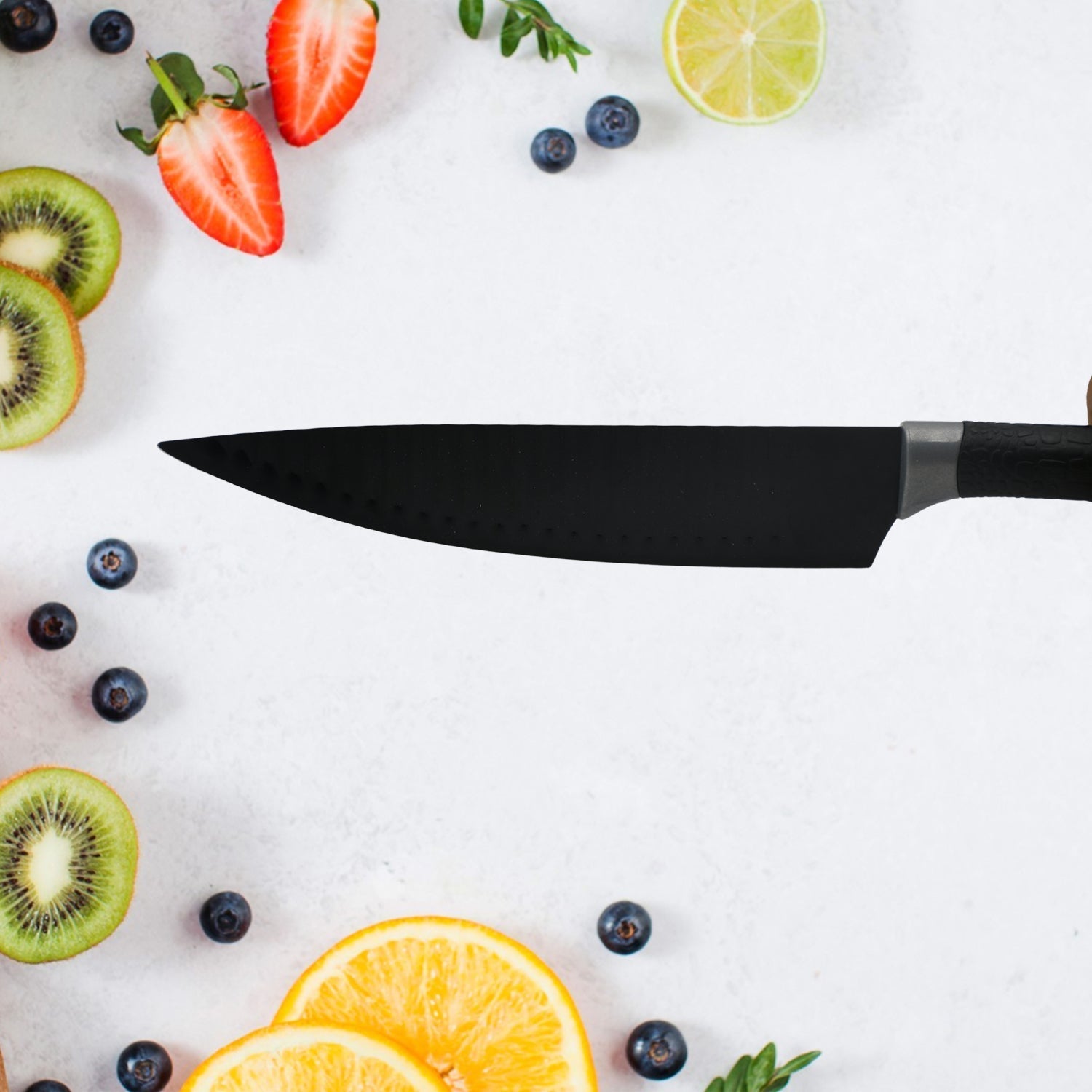 Professional kitchen knives lined up on cutting board