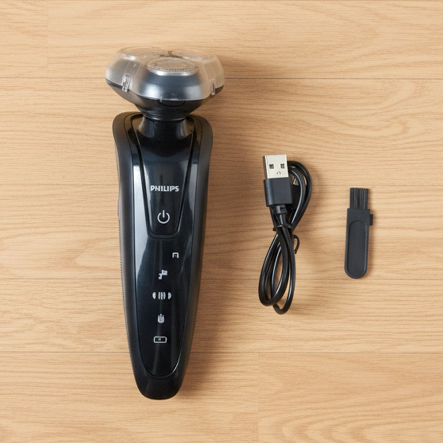 Close up of menâ€™s rotary shaver trimming beard