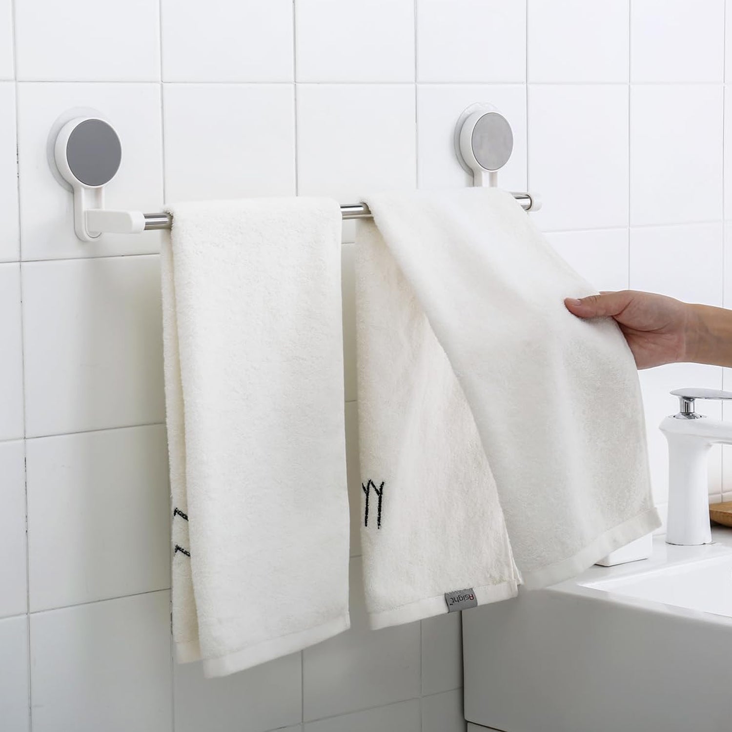 Punch-free towel rod showing stable end brackets on smooth surface