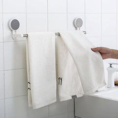 Punch-free towel rod showing stable end brackets on smooth surface